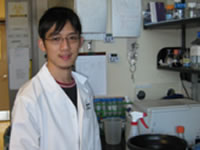 Thai Leong Yap, a post-doctoral fellow, is working in the web lab
