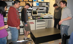 Jennifer and Mark are getting some advice on how to install another new  laser table